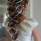 Loose Curly Ponytail Wedding Hairstyle with Ribbon and Baby's Breath 