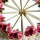 Ivory wedding cake decorated with roses