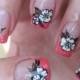 Nail art: Coral french with sweet white flowers