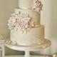 Ivory wedding cake decorated with pink roses