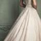 Ivory wedding dress with a pinkish touch