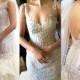 Sleeveless ivory wedding dress decorated with crystals