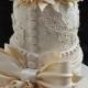 Ivory wedding cake designed like a bridal gown