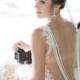 Backless wedding dress decorated with floral patterns