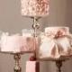 Pink Wedding Cakes On Multilevel Stands. 