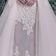white wedding gown decorated with fine floral designs