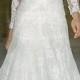 White wedding dress made of shining fabric