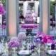 Three Large Mirrors Back The Head Table, Showing Off The Purple Cake And Dramatic Floral Arrangements.