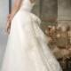 White wedding dress decorated with floral cascade