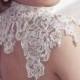 Sleeveless wedding dress with floral laces and crystals