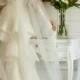 Ivory wedding dress with huge veil