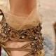 Golden high heels sandals by Christian Louboutin