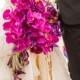 Purple orchids wedding bouquet with ribbon