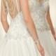 Stylish white wedding gown decorated with rhinestones