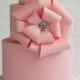 Three-Tiered Pink Cake With Large Bow 
