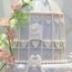 Birdcage wedding cake with pink floral lace