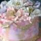Wedding cake with huge flowers with golden stamen