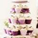 Mountain of Wedding Cupcakes with a beautiful couple on the top