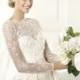 Sophisticated white wedding dress with transparent sleeves