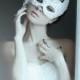 White feather mask for the masquerade wedding