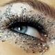 Eye makeup art with silver sparklers