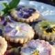 Pansy Shortbread Cookies decorated with mint leaves.