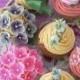 Pretty Cupcakes  with edible blossoms on the top.