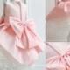 Pink Wedding flower girl gown with a bow