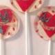 3 Apple Flavored Lollipops With Red Glittered Marzipan Hearts, Love Scrolls, And Glittered Bluebirds