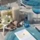 Embrace Nature With Shells, Neutral Linens And Scattered Blooms, With Transparent Blue Chargers And Glassware For A Pop ...