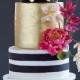 A Modern, Black And Gold Wedding Cake - With Flowers And Fondant Dots And Stripes By Wild Orchid Baking Company