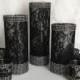 black lace covered glass vases and votive candles with rhinestone