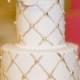 Gold Quilting And A White Rose Dress Up This Miniature Wedding Cake.