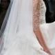 An Ornate Monique Lhuillier Two Tiered Wedding Veil Is Encrusted With Glittering Crystals.
