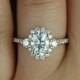 Bridgette 8x6mm 14kt Rose Gold Oval FB Moissanite And Diamonds Halo Engagement Ring (Other Metals And Stone Options Available)