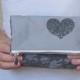 heart accented clutch on fold over style. gray lace with zipper closure. bridesmaids clutch wedding style.