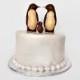Wedding cake topper with child, hand carved penguin couple, baby shower cake