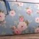 Small Clutch in a blue fabric with flowers very pretty and  romantic bag , wedding purse . Would be great for a night out or for cosmetics.