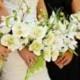 Green and creme orchid and rose silk flower bridal bouquet and boutonniere set