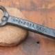 Groomsmen Gift, Hand forged railroad spike bottle opener with the wedding date and name .