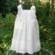 Flower girl dress ivory with satin ribbon shoulder ties, fully lined. .available in sizes 1 thru 10