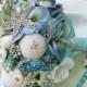 As seen in Pinterest The Blue Sea Shell bridal bouquet. 