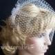 IVORY  birdcagecage veil 12" goes til the pick of the nose. with swarovski crystals on the edge.