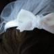 First Communion Headband Veil attached is a White Satin Bow  w/ an Organza Flower Center