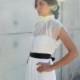 Chic and modern wedding dress with sheer top and black or white belt.