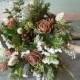 Bridal bouquet made with fresh evergreens and pine cones with birch handle. For your winter woodland natural wedding.