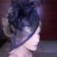Black fascinator with black feather accents Black sinamay fascinator.