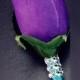 Purple rose boutonniere with Jade ribbon and bling