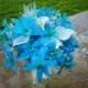 Blue orchid calla lily bouquet with natural preserved baby's breath accent