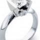 Ladies 14kt white gold modern engagement ring solitaire with 1.50ct Round Brilliant white sapphire and 0.06 carats G-VS2 diamonds